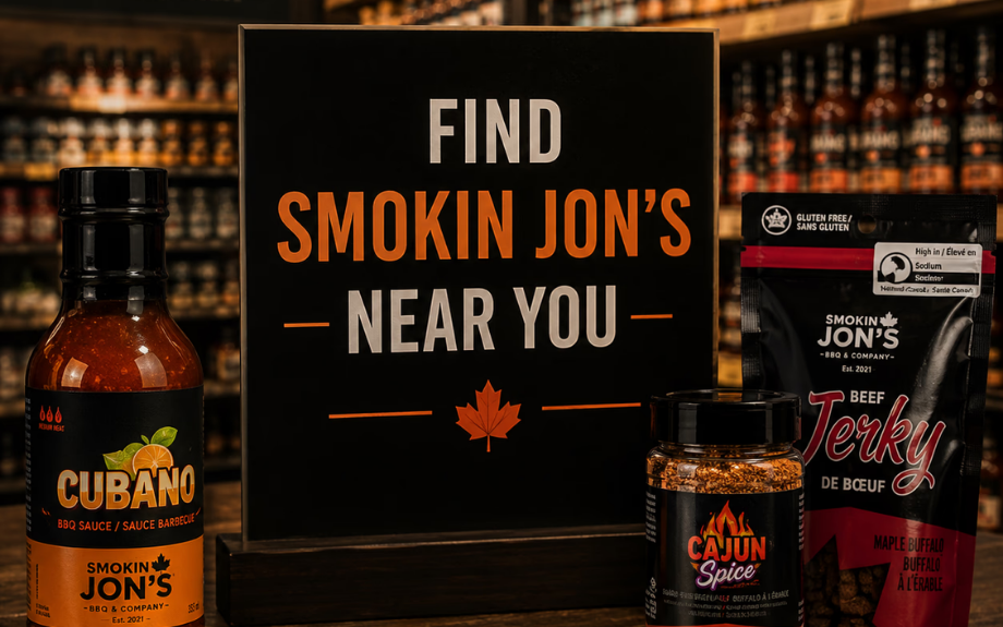 Retail shelf display with a Find Smokin Jon's Near You chalkboard sign, sauce bottle, spice jar and jerky pouch